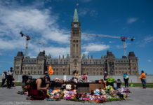 Photo Essay: Dozens gather to remember residential school children found in unmarked burial site