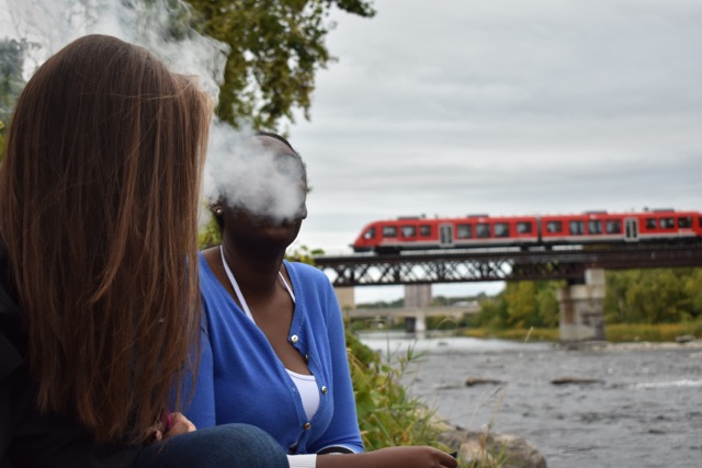 Students smoking on campus. [Photo by Spencer Colby]