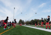 Ravens drop home opener in low-scoring Bytown Battle Women's soccer players playing keep up.