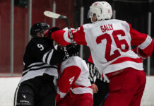 Men’s hockey splits home opener with wildly different games