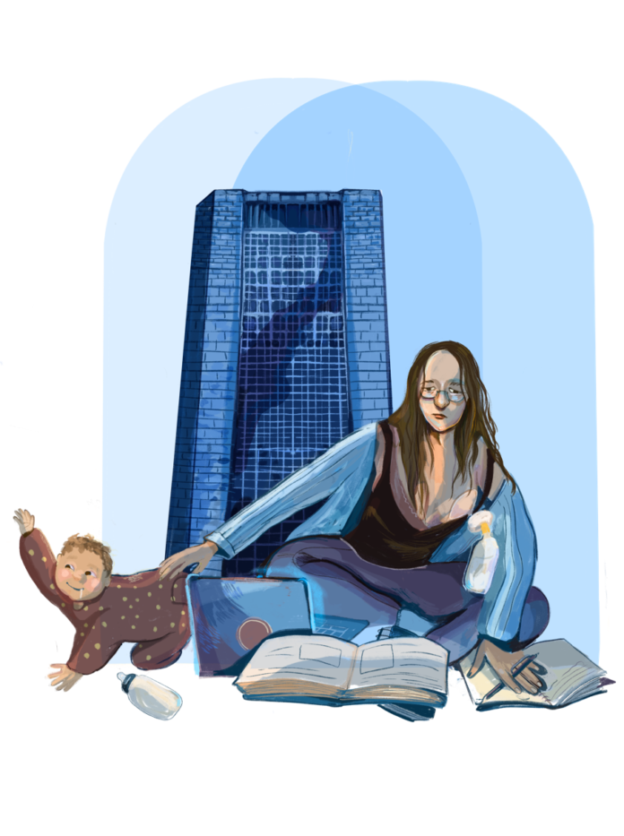 A mother sitting and studying while holding the t-shirt of her baby who is crawling away. Dunton tower stands in the back.