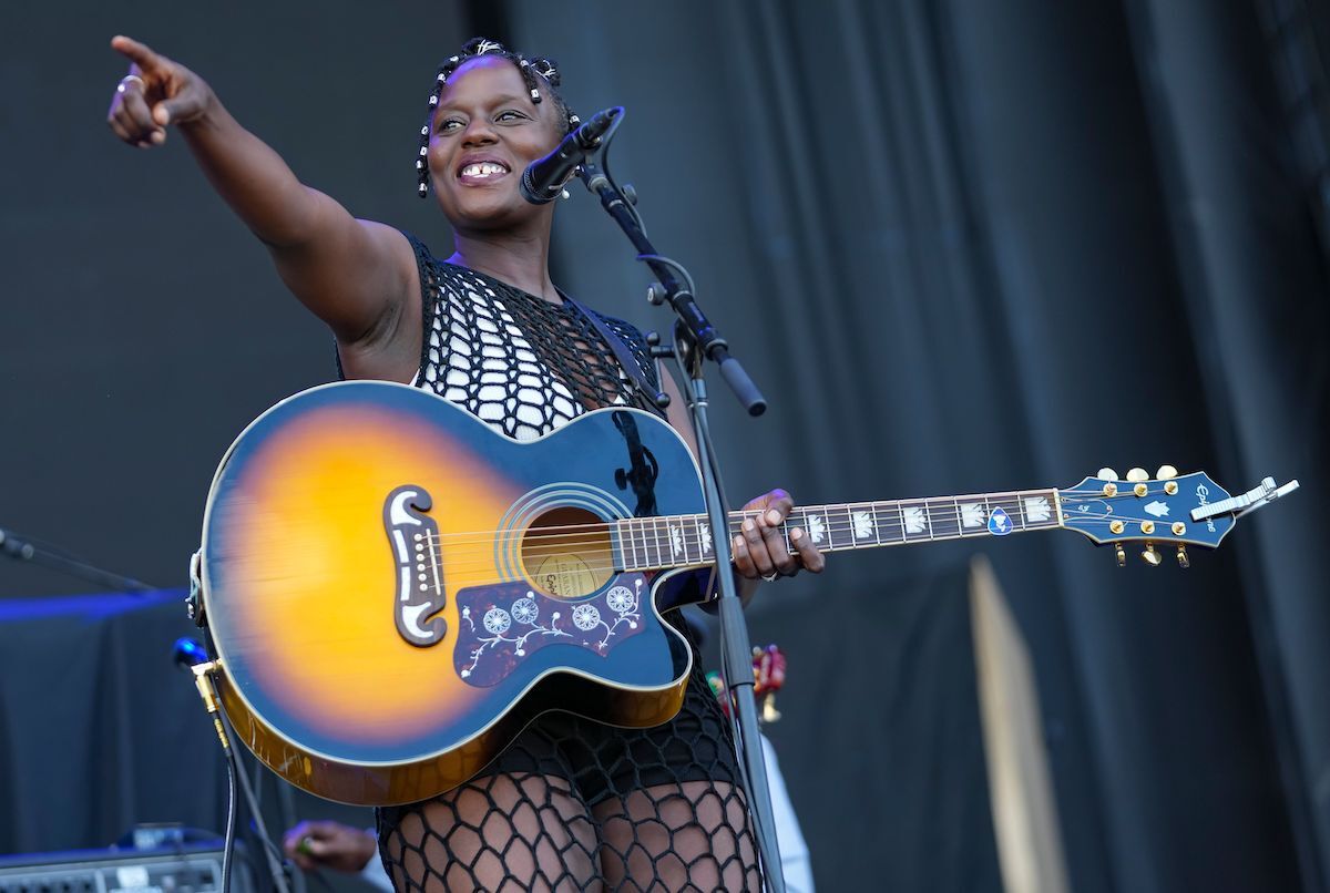 NAMBI performs at Bluesfest. She is smiling and pointing to the crowd.
