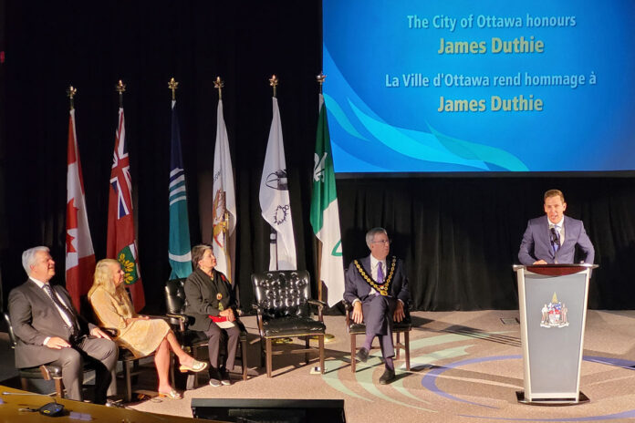 James Duthie giving a speech at a ceremony at City Hall