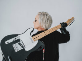 Dawn Sev poses with her guitar in 2022. [Photo provided by Dawn Sev]