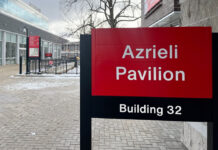 ‘Crimes against humanity’: SJP seek to remove Azrieli name at Carleton Photo of a panel that reads "Azrieli Pavilion" at Carleton University.