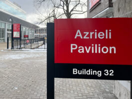 Photo of a panel that reads "Azrieli Pavilion" at Carleton University.