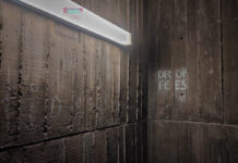 A wall of fees: Carleton international students’ grim future a wall in a UC hallway reads "drop fees" in chalk