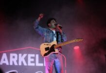 Perspective: How the Arkells are bringing uniquely Canadian spirit A man with a guitar sings on stage
