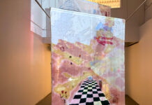 Embroidery exhibit threads ties between lands and bodies