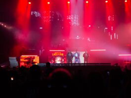 Ottawa Bluesfest headliner 50 Cent raps and ignites the crowd on July 6, 2024. [Photo by Darren Tran/The Charlatan]