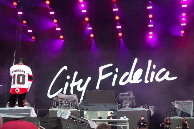 Ottawa-based City Fidelia displays his Senators jersey to the crowd on July 6, 2024. [Photo by Darren Tran/The Charlatan]