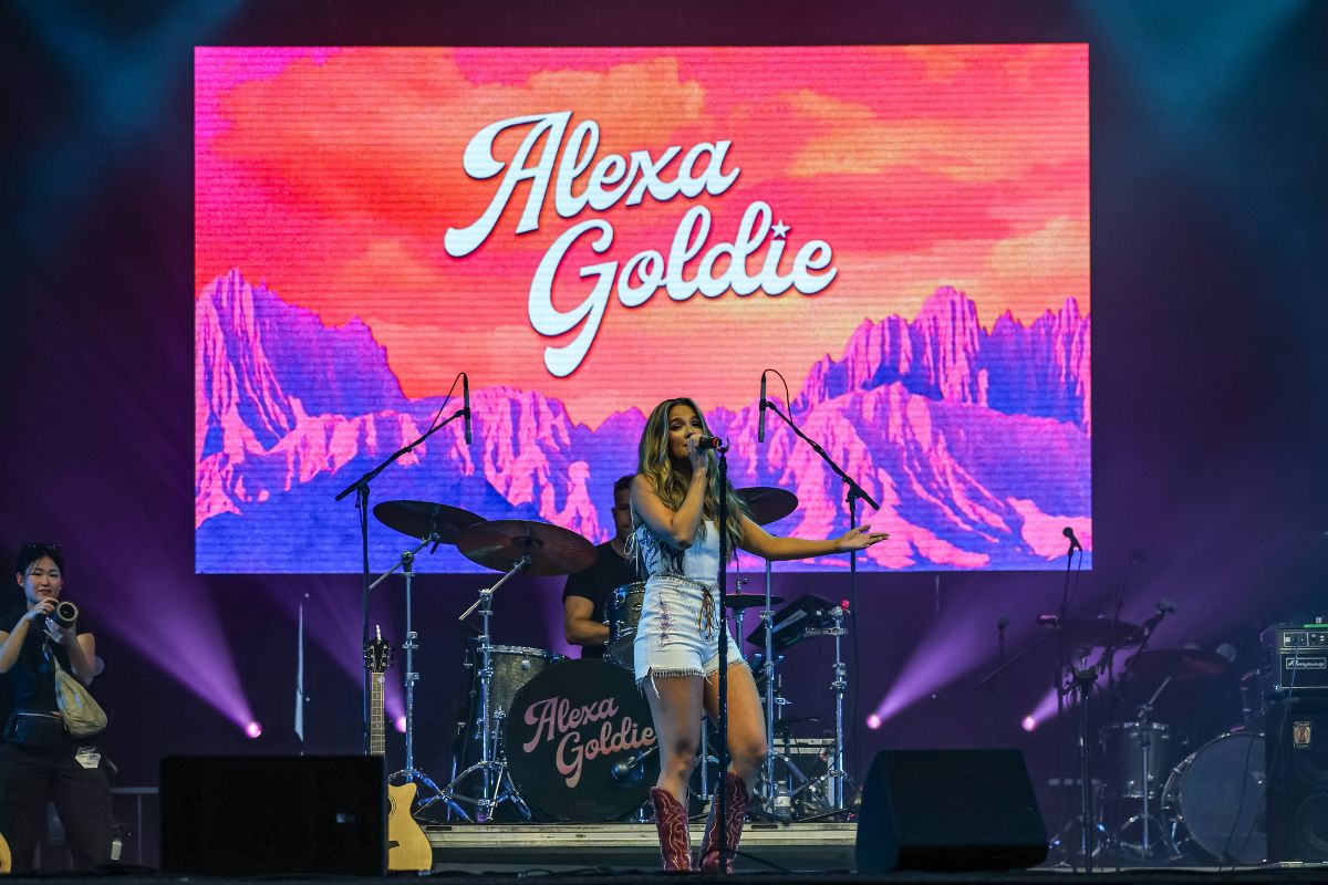 Alexa Goldie sings to the crowd wearing red cowboy boots on July 11, 2024. [Photo by Greg Kolz via Bluesfest]