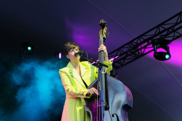 Bridget Kearney picks the strings on the double bass at the Ottawa Jazz Festival on June 27, 2024. [Photo by Natasha Baldin/The Charlatan]
