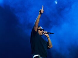 Hip-hop legend Nas raises his hand in the air during his performance at Bluesfest on July 14, 2024. [Photo by Darren Tran/The Charlatan]