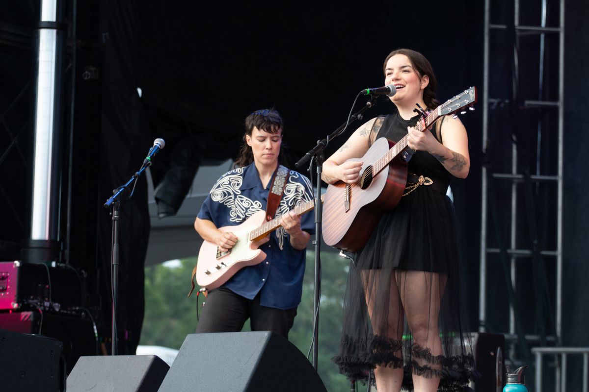 Geneviève Racette serenades attendees while also playing the guitar on July 14, 2024. [Photo by Darren Tran/The Charlatan]