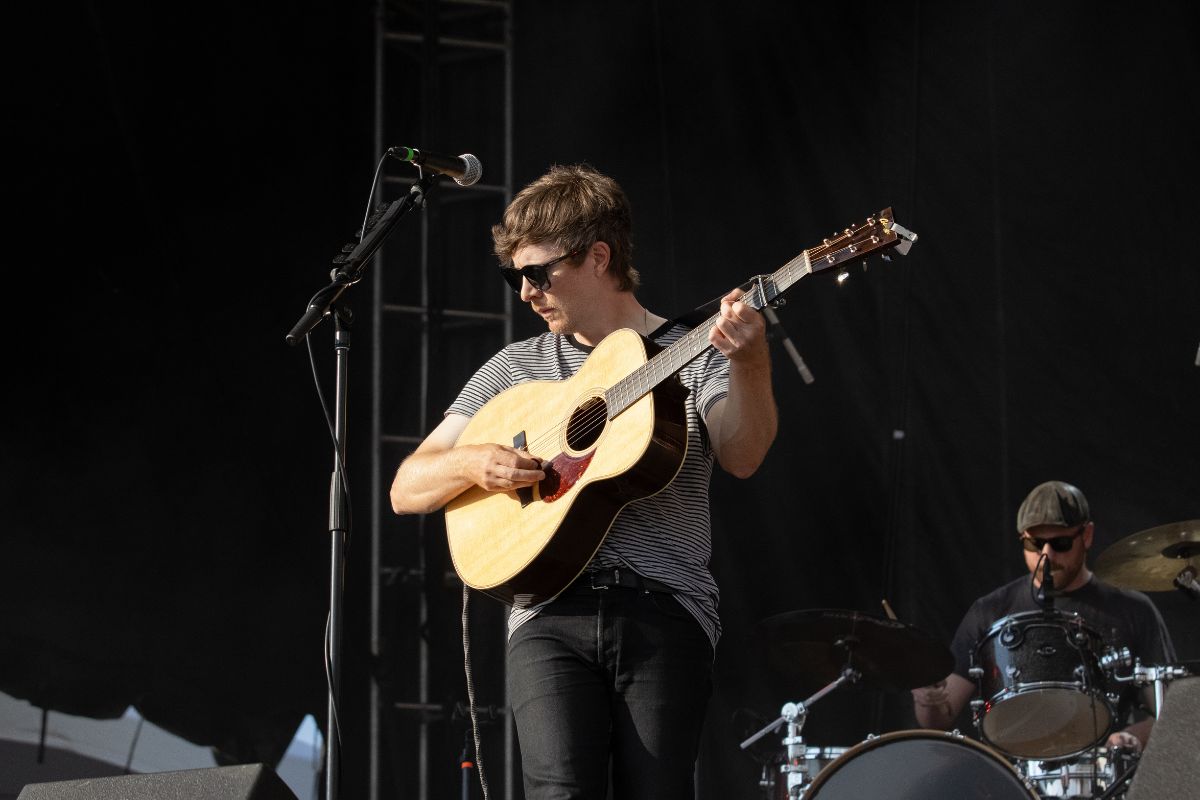 Summersets frontman Kalle Mattson strums his guitar on the River Stage on July 12, 2024. [Photo by Nisse Anonby/The Charlatan]