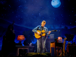 Ottawa Bluesfest headliner Tyler Childers strums his guitar on July 12, 2024. [Photo by Sean Sisk via Bluesfest]