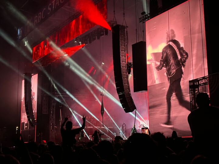 Ottawa Bluesfest headliner Mötley Crüe rock out on the RBC Stage on July 13, 2024. [Photo by Alexa MacKie/The Charlatan]