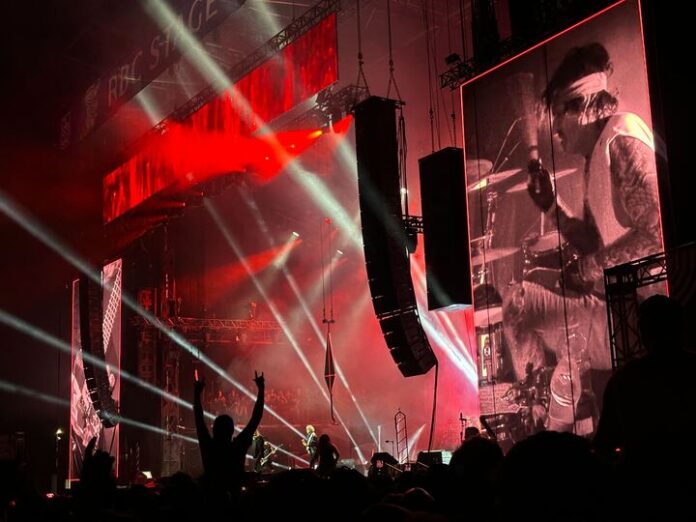 Ottawa Bluesfest headliner Mötley Crüe rock out on the RBC Stage on July 13, 2024. [Photo by Alexa MacKie/The Charlatan]