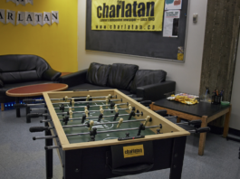 A foosball table sits in the middle of the Charlatan office.