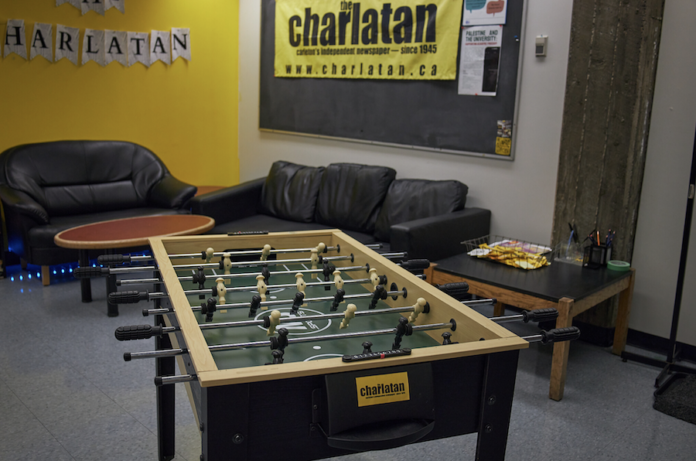 A foosball table sits in the middle of the Charlatan office.