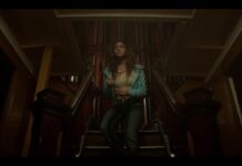Review: ‘Time Cut’ amuses, but ultimately falls flat Walking down the stairs in a dark and gloomy looking basement, a girl in jeans and a white tshirt holds a knife and looks scared.