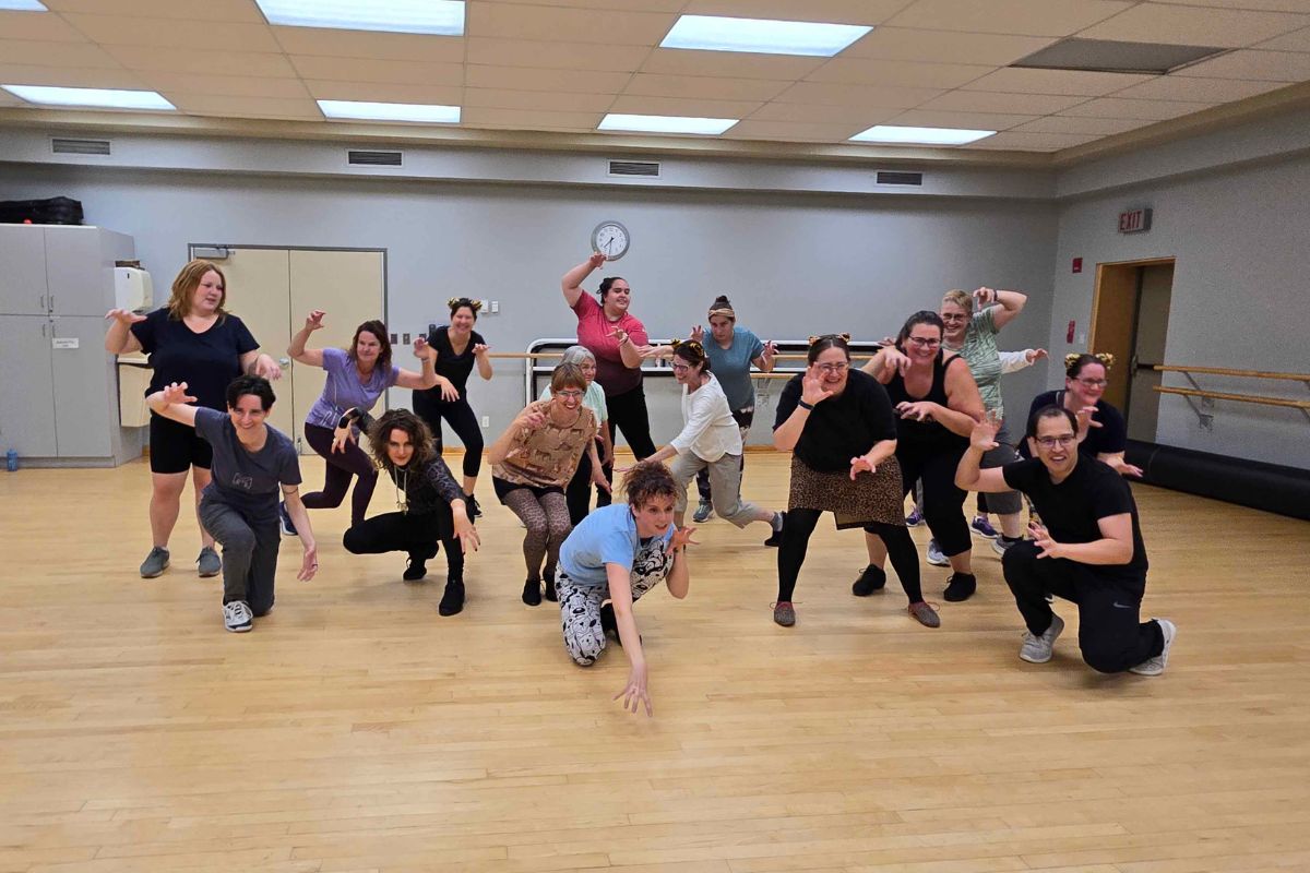 Broadway Workout choreographer Alex Smith-Eivemark poses with her class at the Greenboro Community Centre on Oct. 28, 2024.