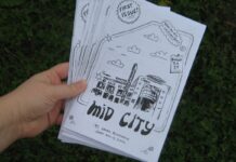 Q&A: How ‘MidCity’ zine aims to make Ottawa’s municipal politics more accessible Amid a green background of grass, a hand holds out a white zine that has a drawing of buildings and has the title "MidCity" on it