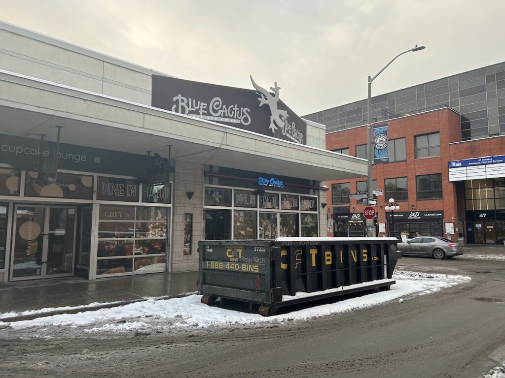 Restaurant with a dumpster bin in front of it