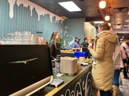 A barista at EP Café interacts with a customer at the cafe cash register during the launch event on Jan. 22, 2025.