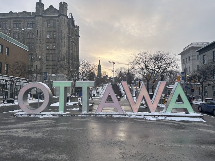 Ottawa sign surrounded by snow