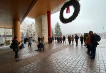 ‘Mess of the city’s own making’: Ottawa community rallies against 2025 city budget A group of people standing outside City Hall.