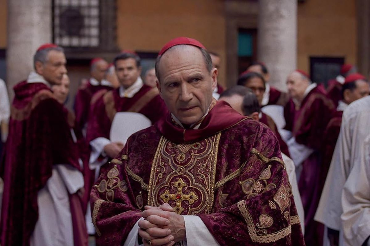 Man in priest outfit looking startled. 