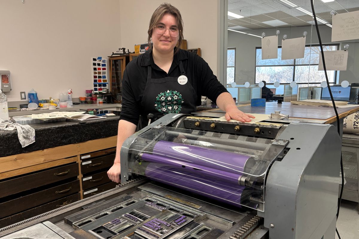 Sarah Pelletier, senior Book Arts Lab assistant, collaborates with other students to design the posters for the “Steal This Poster” campaigns. [Photo by Alexa MacKie/The Charlatan]