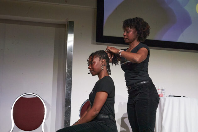 Twin sisters and co-founders of Frizé Frizé hair services perform live hair care demonstrations and answer questions from the audience at the Crépu: Our DNA event on Feb. 2, 2025.