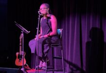 ‘In Our Tongues’ celebrates Black History Month, poetry and writers Black woman sits on stool on stage