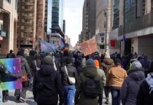 Dozens march through Ottawa condemning facism and advocating for women’s rights