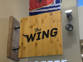 Wooden sign reading The Wing.