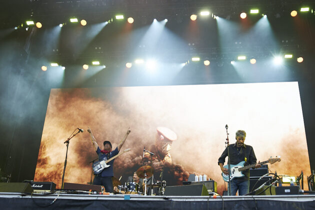 A band performs on a stage.