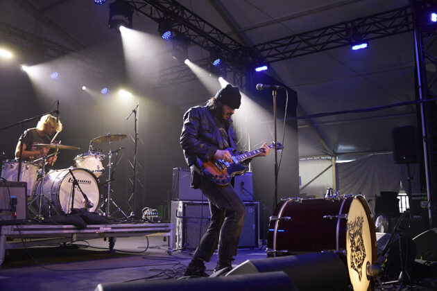 A person performs on a stage