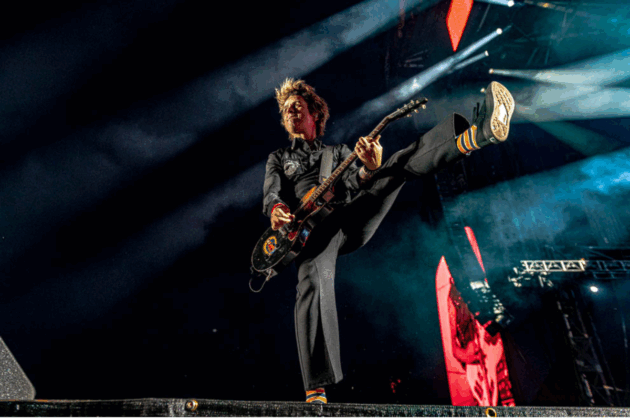 A guitarist jams out on stage.