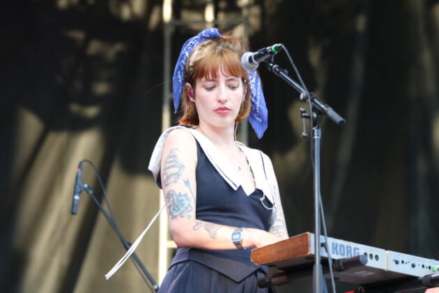 A keyboard player plays on stage.
