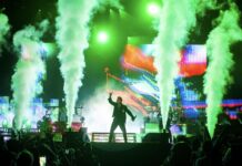 Bluesfest Day 8 review: Papa Roach keeps LeBreton Flats sharp with nu metal anthems, mental health awareness A singer performs on a stage with green smoke