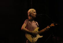 Bluesfest Day 3 review: Men I Trust, Turnstile take to evening of shoegaze and sweat A person performs on a dark stage