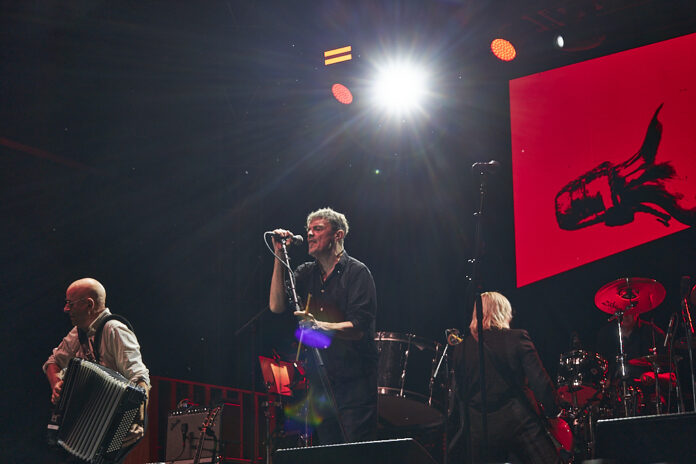 A band performs on stage.