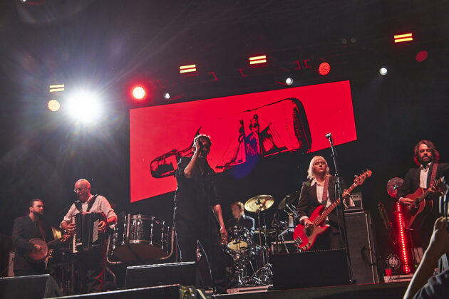 A band performs on stage.