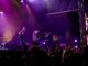 Here’s what you need to know ahead of CityFolk 2026 A band performs on stage under purple lighting.
