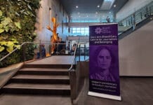 ‘A time of resistance’: New Carleton lecture series spotlights change in journalism a banner saying "Mary Ann Shadd Cary Centre for Journalism and Belonging" with a picture of a woman on it standing in a building