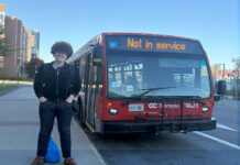 ‘You can’t ignore us anymore’: Meet Carleton’s new transit advocacy club A person stands next to an OC Transpo bus that says "Not in service"