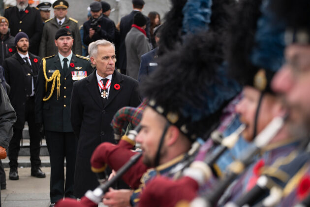 Mark Carney looks to the side.